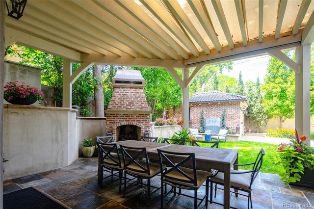 a patio with table and chairs