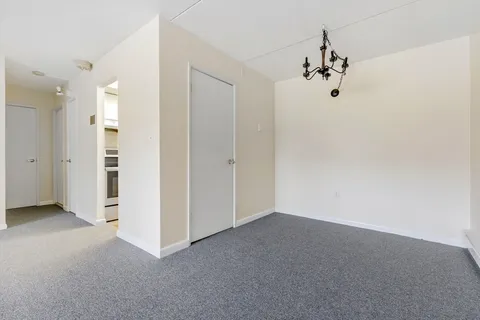 an empty room with a empty space and window