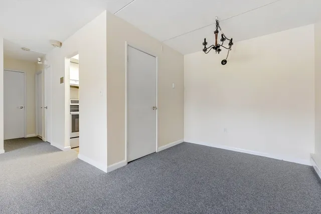 an empty room with a empty space and window