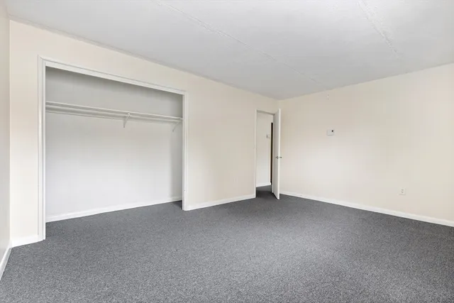 a white toilet sitting next to a bath tub