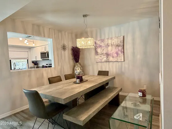 a view of a white house with a yard