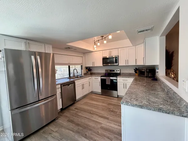 a view of a dining room with furniture and window