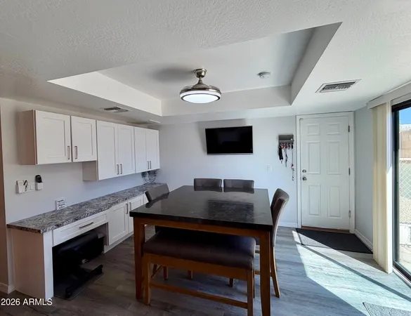 a kitchen with stainless steel appliances granite countertop a refrigerator sink and microwave