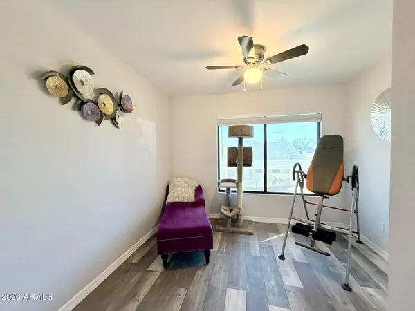 a room with a toilet a sink and a mirror