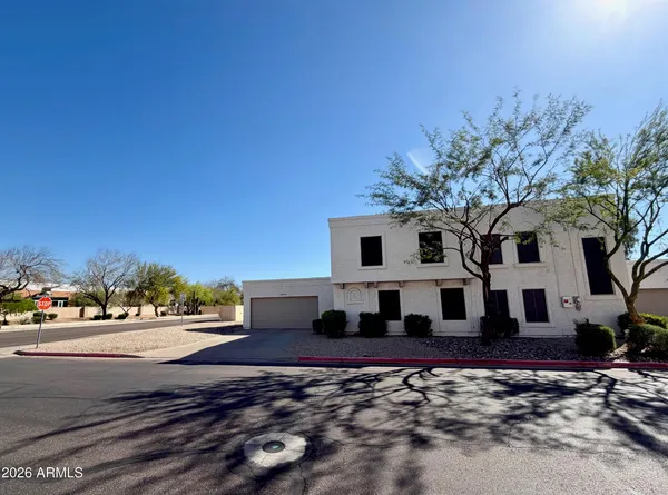 a view of a livingroom with furniture and a window