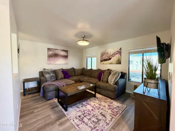 a living room with furniture and a rug