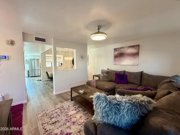 a view of a patio with couches and potted plants