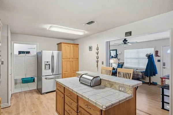a room with a table chairs and wooden floor