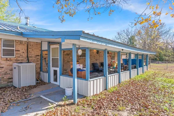 a view of a house with a yard and pathway