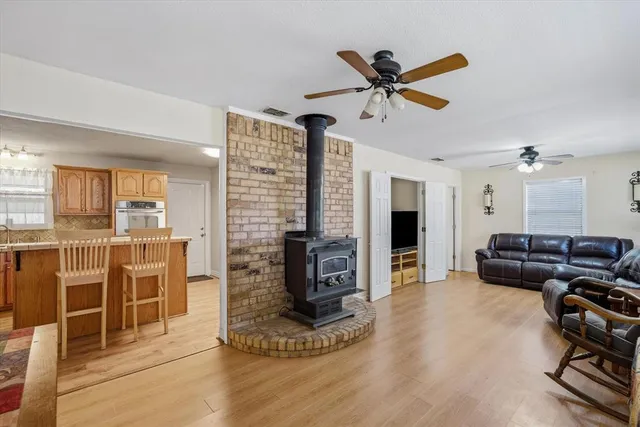 a view of a livingroom with furniture and a ceiling fan