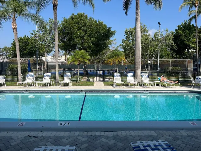 a view of a swimming pool with a patio