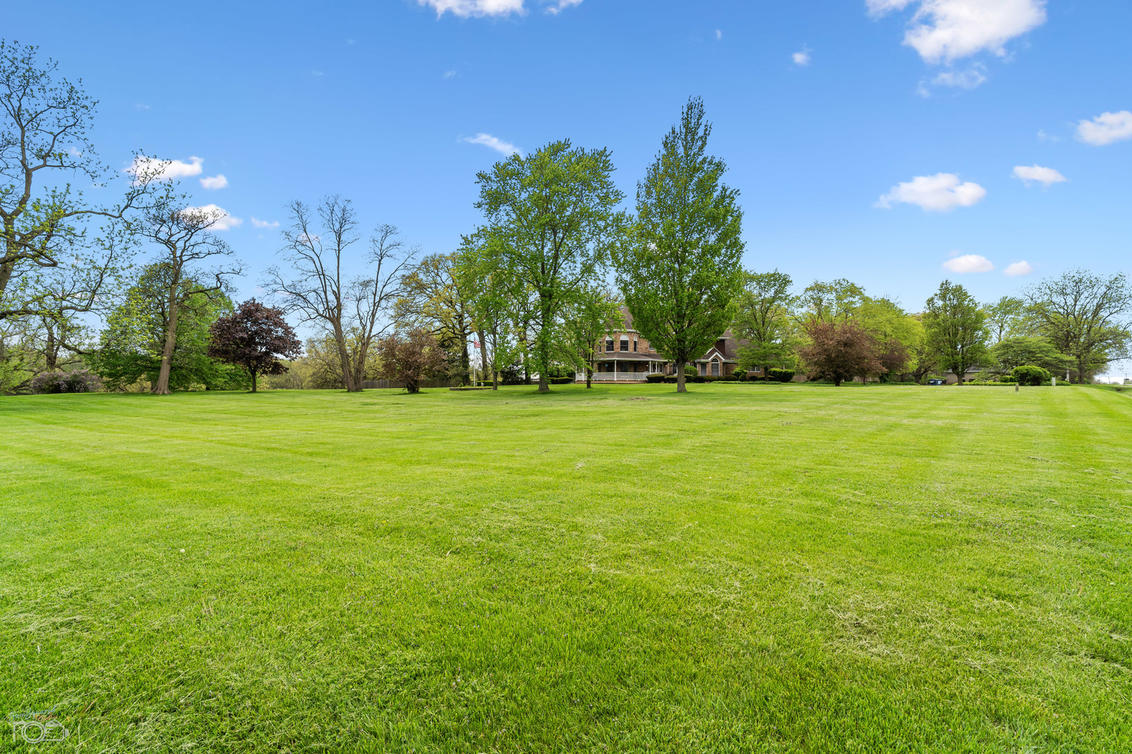16015 West Baker Road Manhattan, IL 60442 - Photo 17 of 66 a view of a big yard with a house in the background