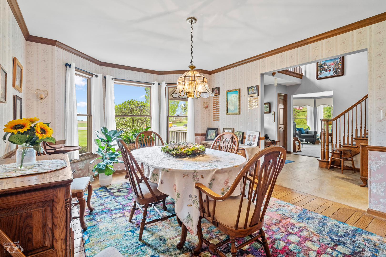 16015 West Baker Road Manhattan, IL 60442 - Photo 28 of 66 a view of a dining room with furniture window and wooden floor