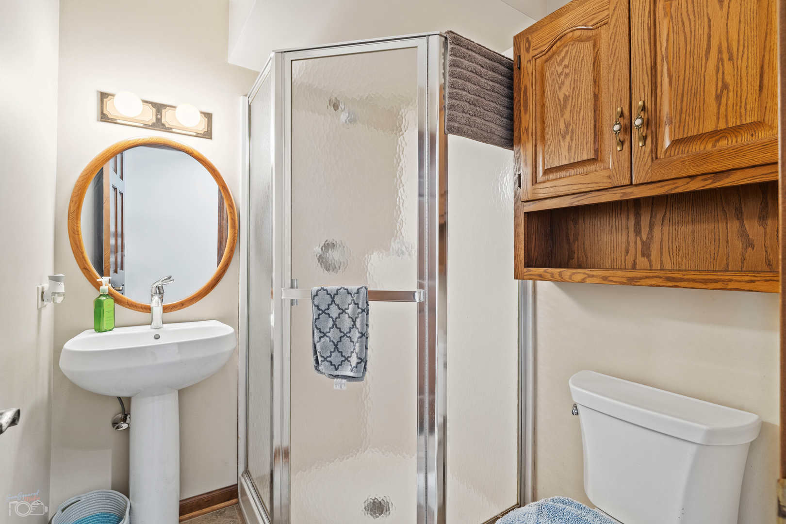 16015 West Baker Road Manhattan, IL 60442 - Photo 41 of 66 a bathroom with a toilet a sink and a mirror