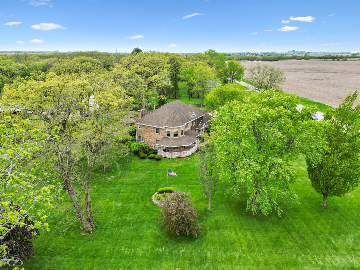 16015 West Baker Road Manhattan, IL 60442 - Photo 59 of 66 a view of a lush green forest with a lake view