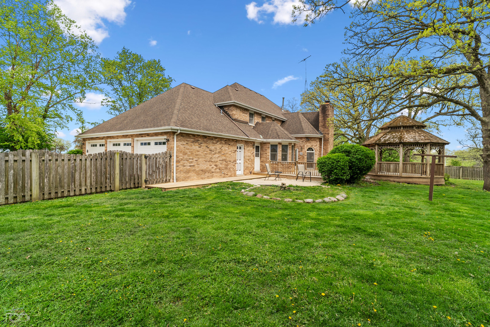 16015 West Baker Road Manhattan, IL 60442 - Photo 7 of 66 a front view of a house with a garden