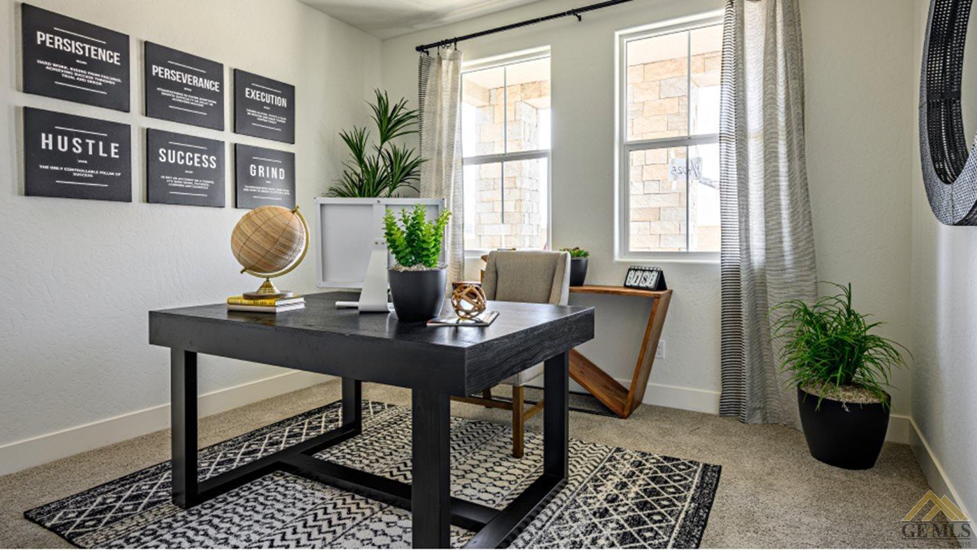 Undisclosed Address Bakersfield, CA 93313 - Photo 13 of 17 a view of a workspace with a table and chair in the room