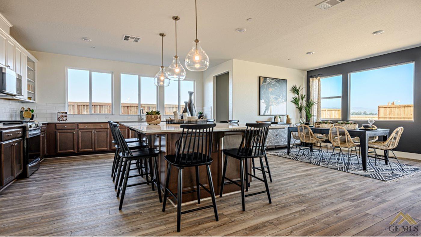 Undisclosed Address Bakersfield, CA 93313 - Photo 4 of 17 a view of a dining room with furniture window and wooden floor