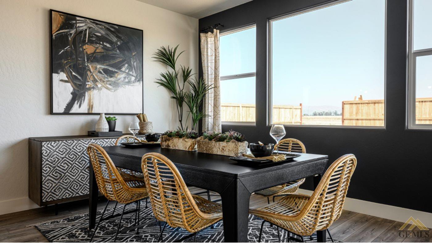 Undisclosed Address Bakersfield, CA 93313 - Photo 5 of 17 a view of a dining room with furniture window and wooden floor