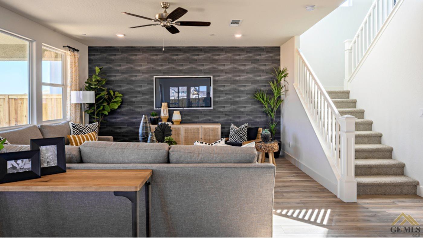 Undisclosed Address Bakersfield, CA 93313 - Photo 7 of 17 a living room with furniture and a fireplace