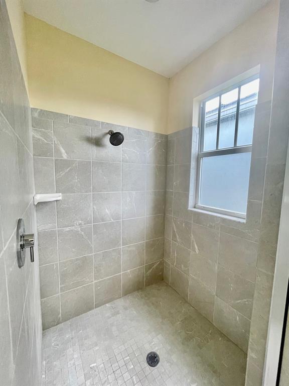 4803 Northwest 48th Terrace Tamarac, FL 33319 - Photo 17 of 28 a bathroom with a shower