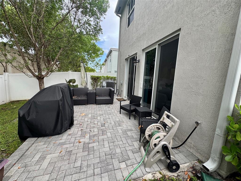 4803 Northwest 48th Terrace Tamarac, FL 33319 - Photo 25 of 28 a view of a backyard with furniture and outdoor space