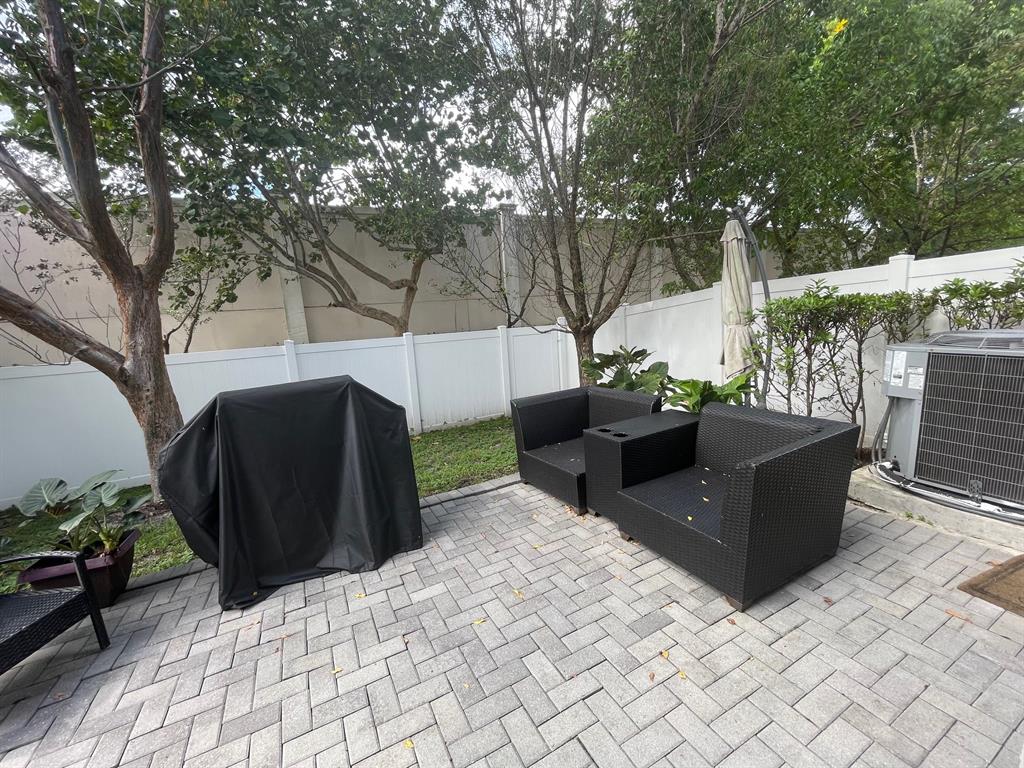4803 Northwest 48th Terrace Tamarac, FL 33319 - Photo 26 of 28 a view of a couches in the patio