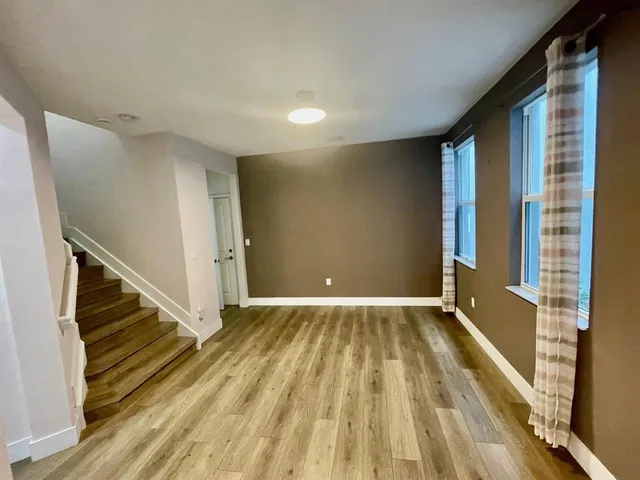 a view of an empty room with stairs