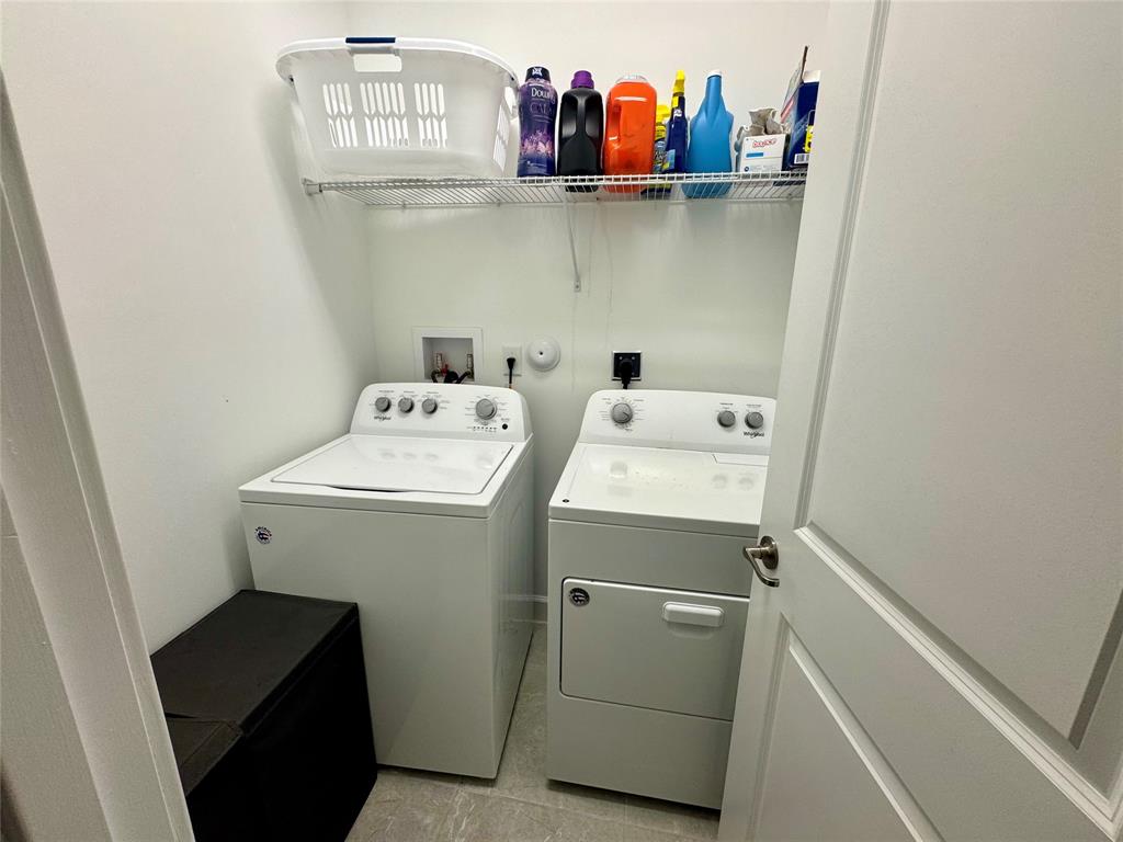 4803 Northwest 48th Terrace Tamarac, FL 33319 - Photo 10 of 28 a utility room with dryer and washer