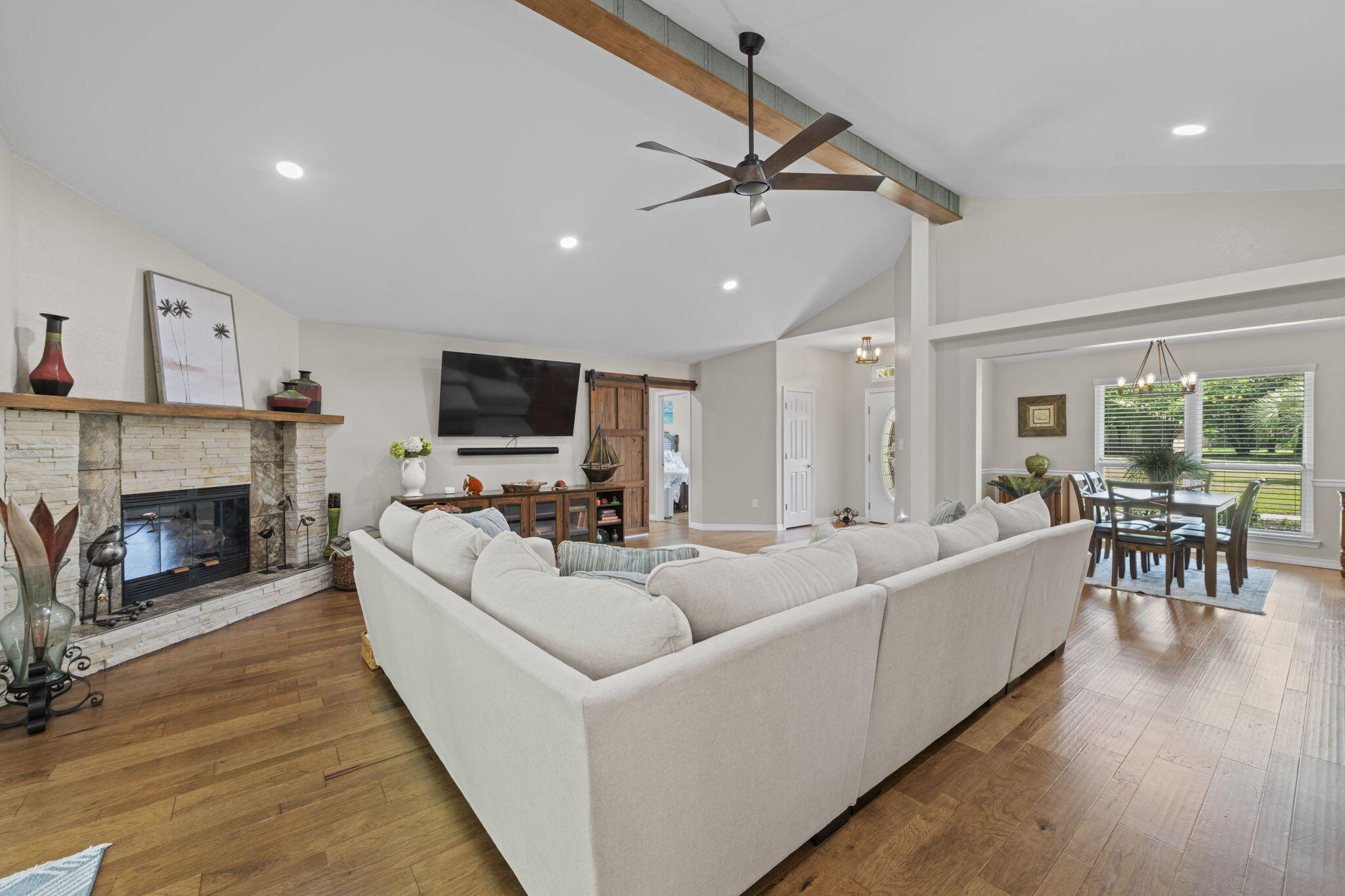 2519 Valley Road Navarre, FL 32566 - Photo 14 of 94 a living room with furniture a fireplace and a flat screen tv