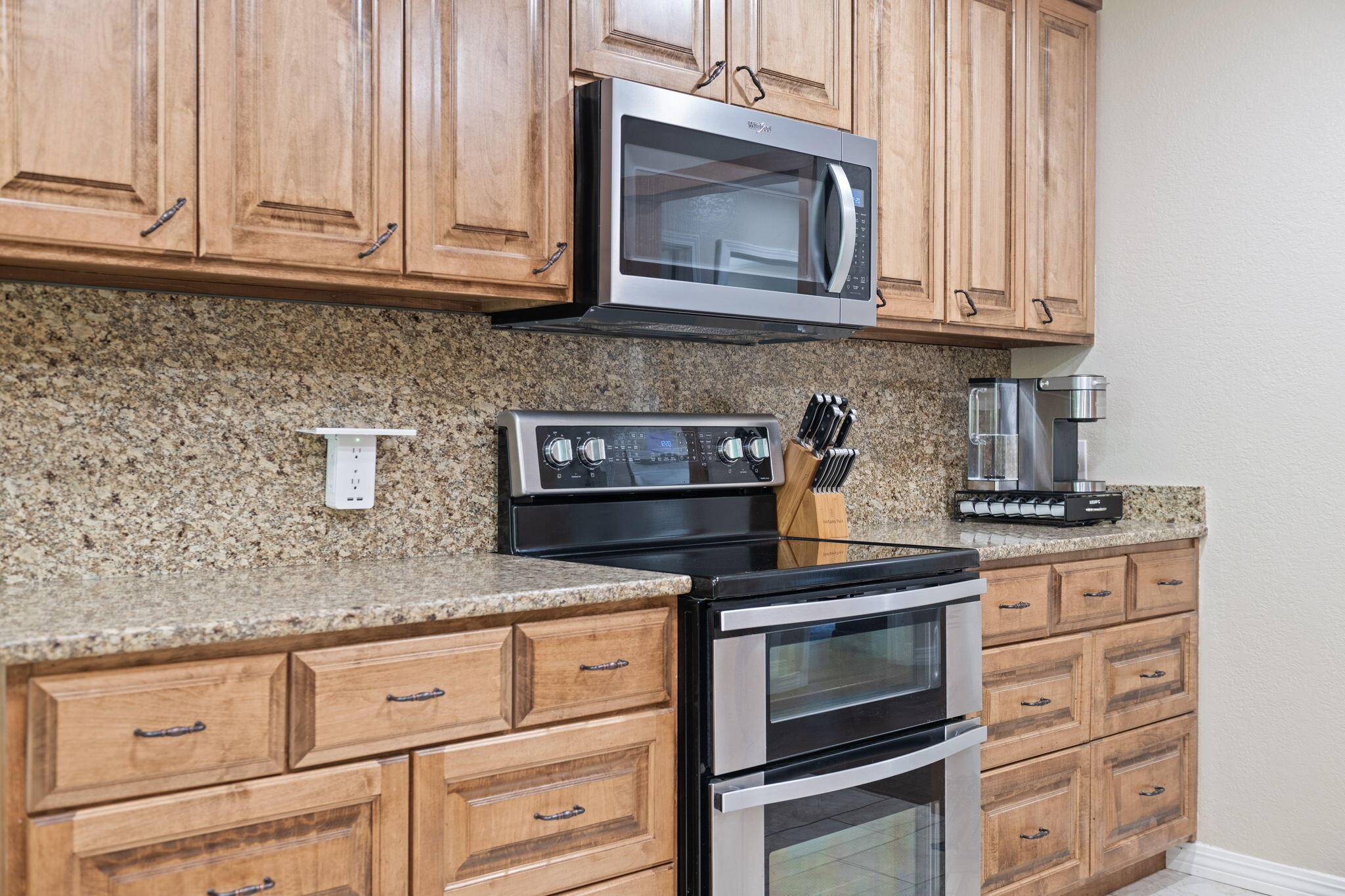 2519 Valley Road Navarre, FL 32566 - Photo 22 of 94 a kitchen with granite countertop white cabinets and stainless steel appliances