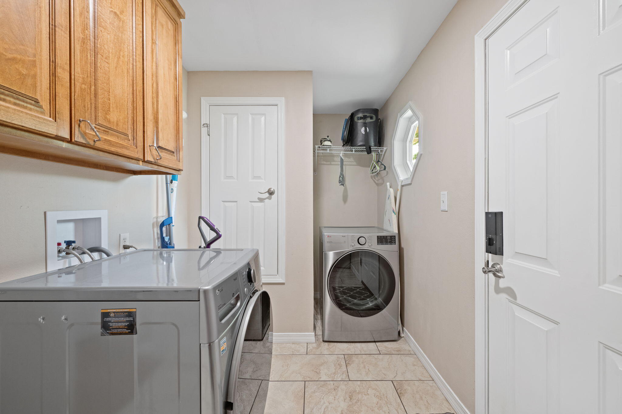 2519 Valley Road Navarre, FL 32566 - Photo 30 of 94 a utility room with sink dryer and washer