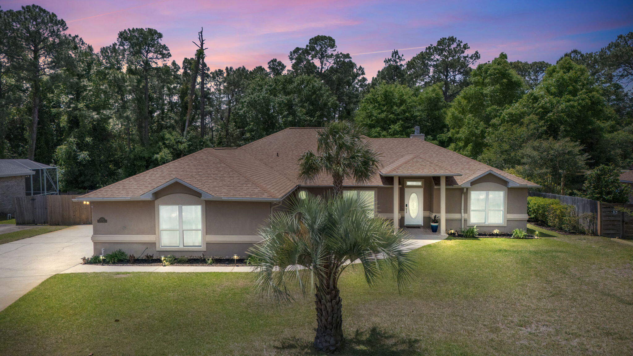 2519 Valley Road Navarre, FL 32566 - Photo 3 of 94 a front view of a house with a yard and garage