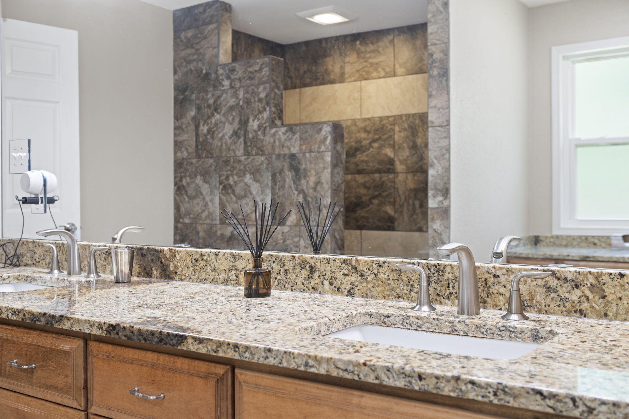 2519 Valley Road Navarre, FL 32566 - Photo 38 of 94 a bathroom with a granite countertop sink and a mirror