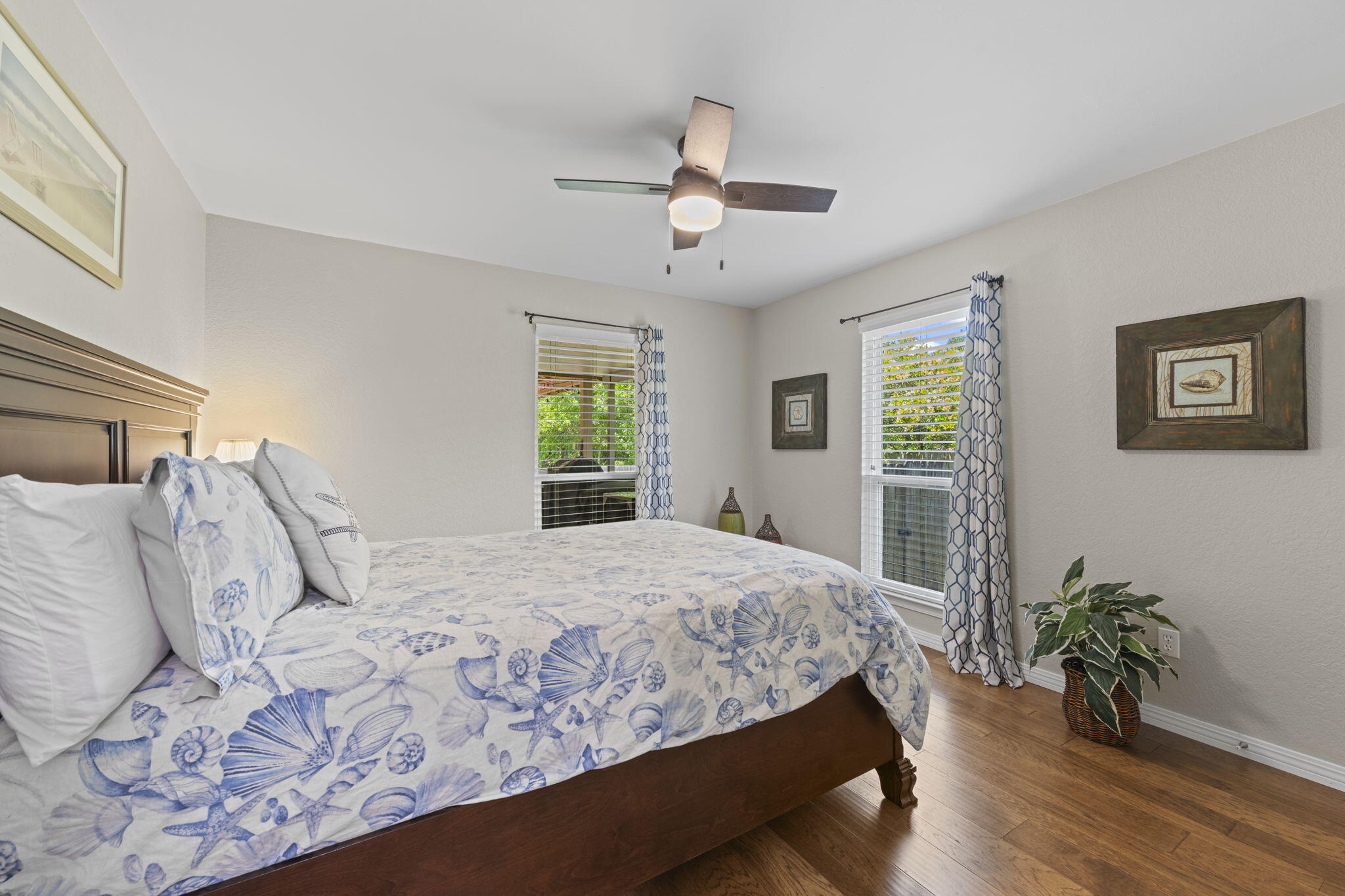 2519 Valley Road Navarre, FL 32566 - Photo 49 of 94 a bedroom with a large bed chandelier and a window