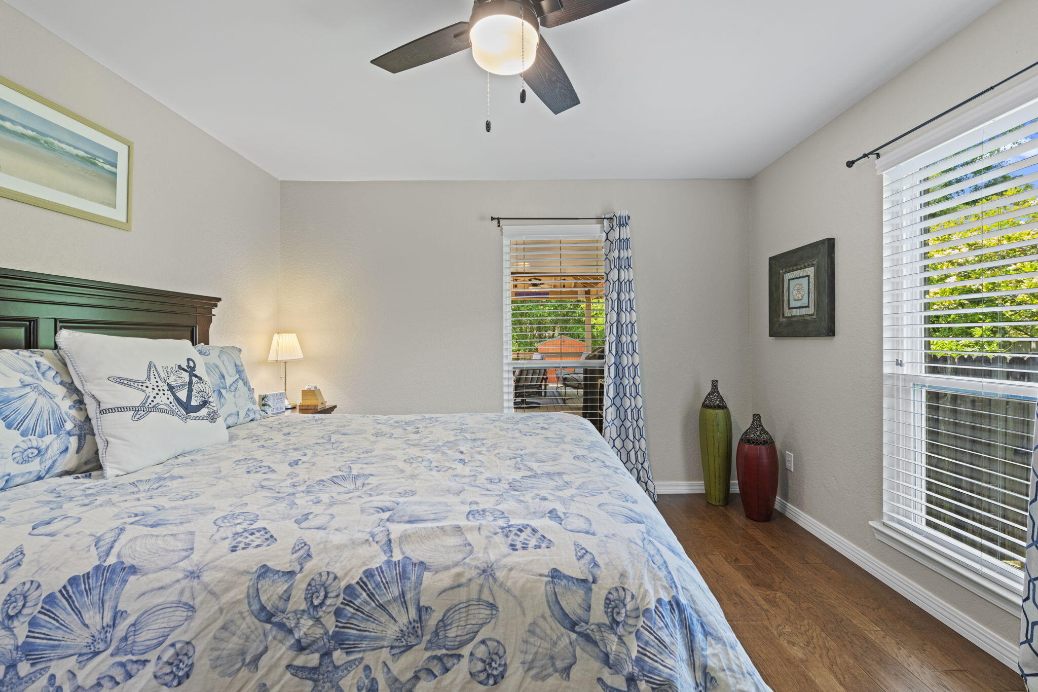 2519 Valley Road Navarre, FL 32566 - Photo 50 of 94 a bedroom with a large bed and wooden floor