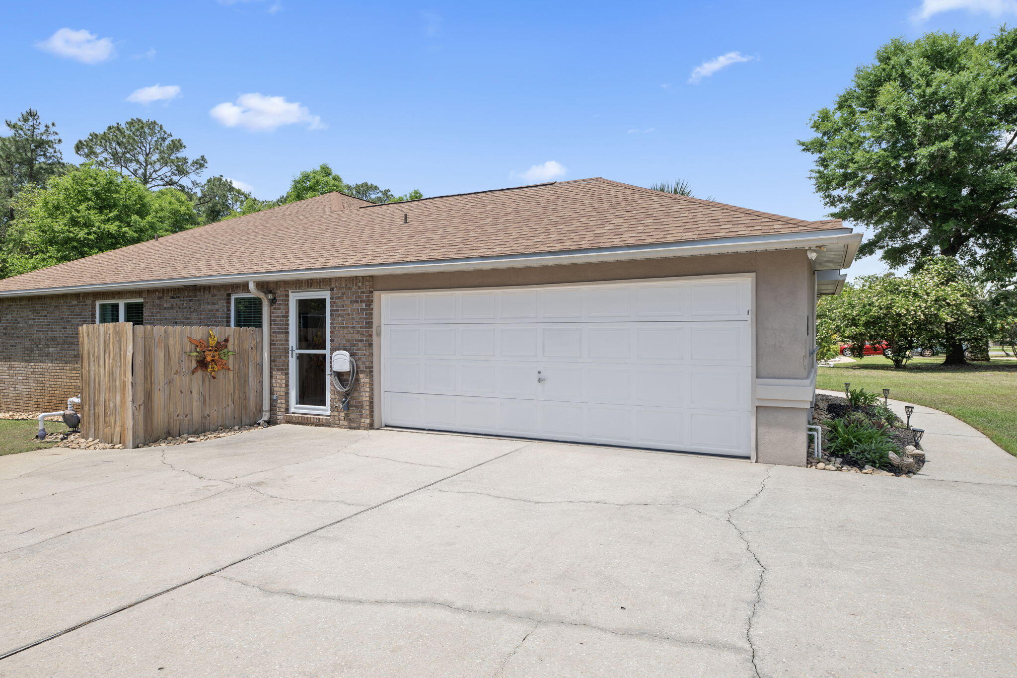 2519 Valley Road Navarre, FL 32566 - Photo 64 of 94 a front view of a house with a garage