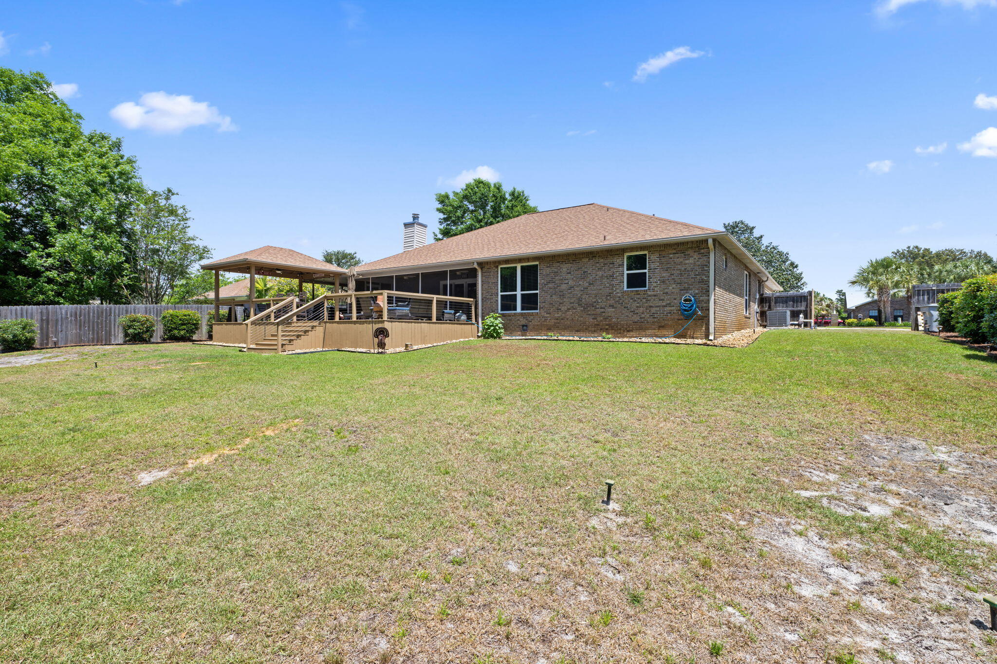 2519 Valley Road Navarre, FL 32566 - Photo 67 of 94 a view of a house with a yard