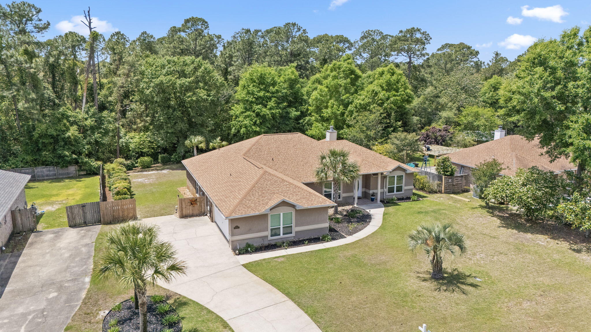 2519 Valley Road Navarre, FL 32566 - Photo 73 of 94 an aerial view of a house with swimming pool and large trees