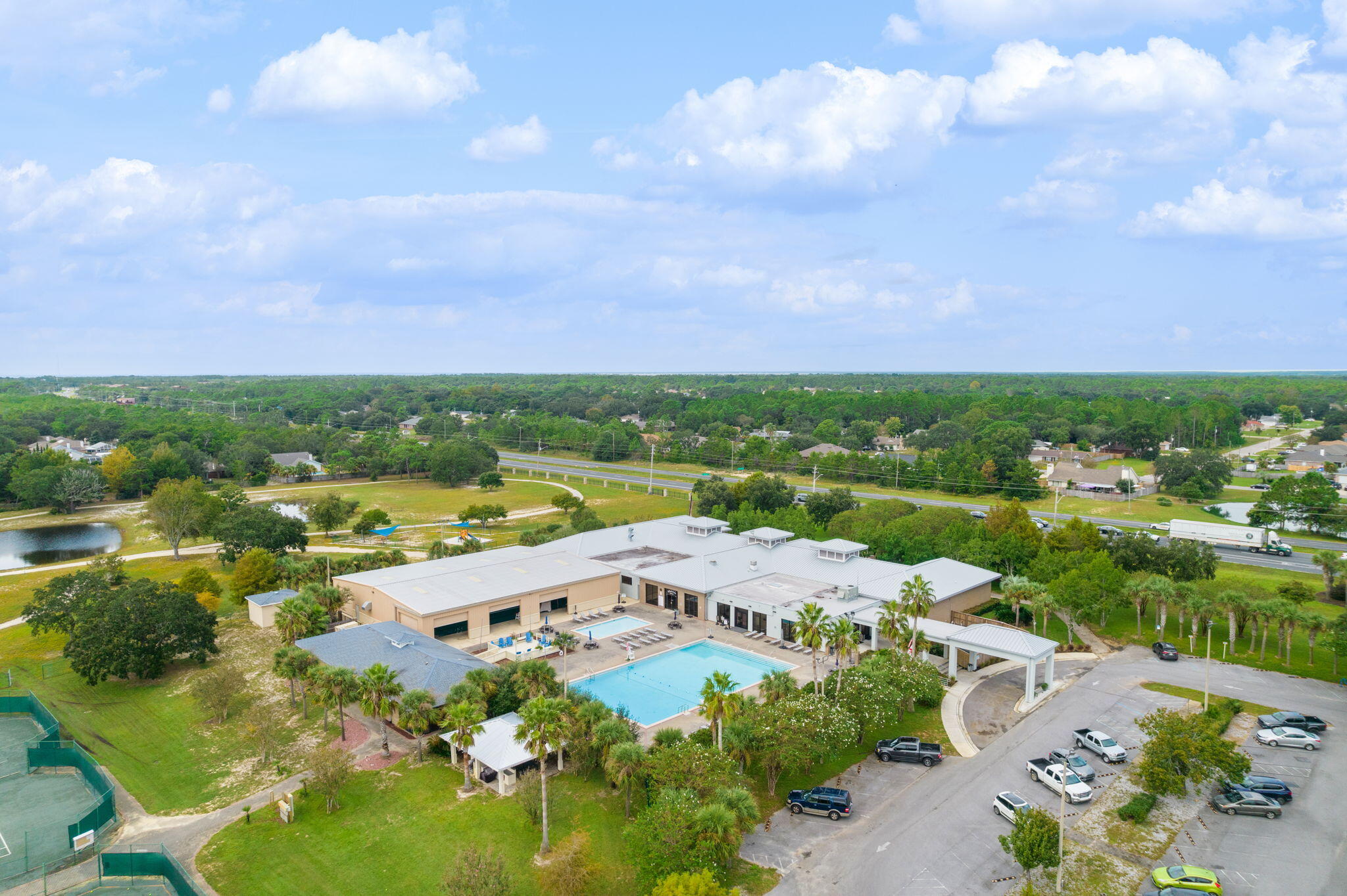 2519 Valley Road Navarre, FL 32566 - Photo 90 of 94 an aerial view of a city with lots of residential buildings ocean and mountain view in back