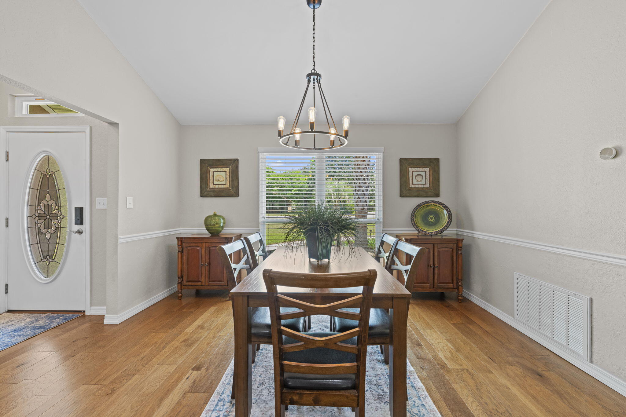 2519 Valley Road Navarre, FL 32566 - Photo 10 of 94 a view of a dining room with furniture window and wooden floor