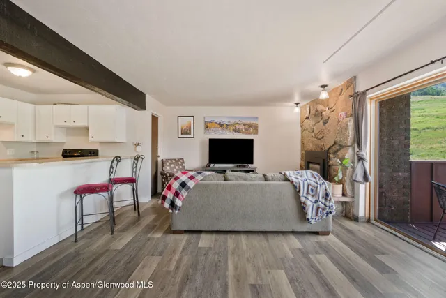 a bedroom with a large bed and a large window