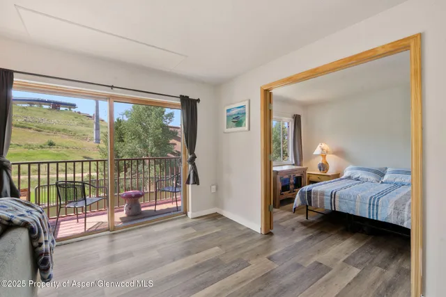 a kitchen with granite countertop white cabinets and black appliances