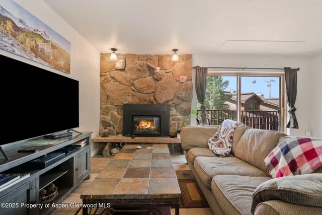 a bedroom with a bed closet and a large mirror