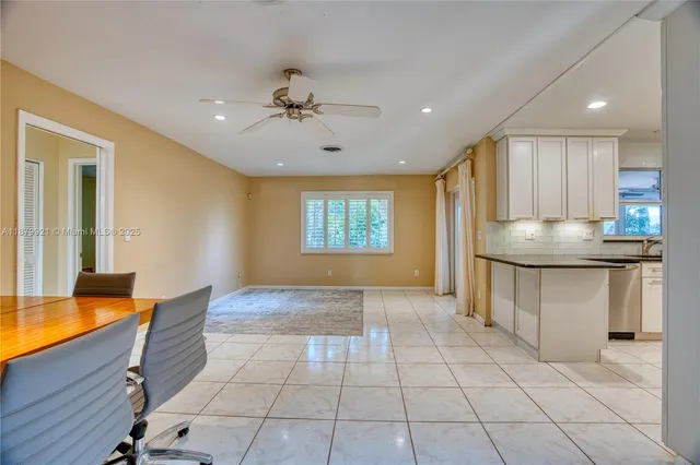 a kitchen with counter top space cabinets and window