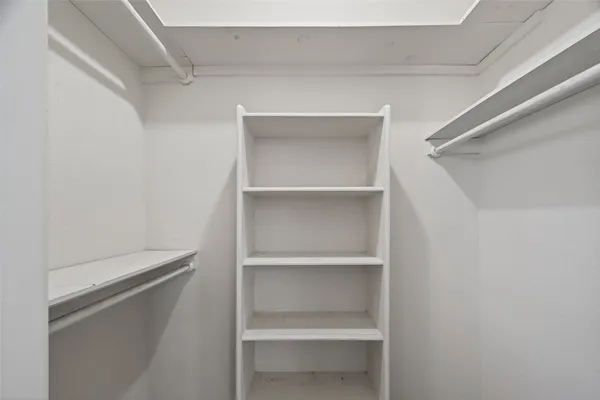 a bathroom with a granite countertop bathtub shower and toilet