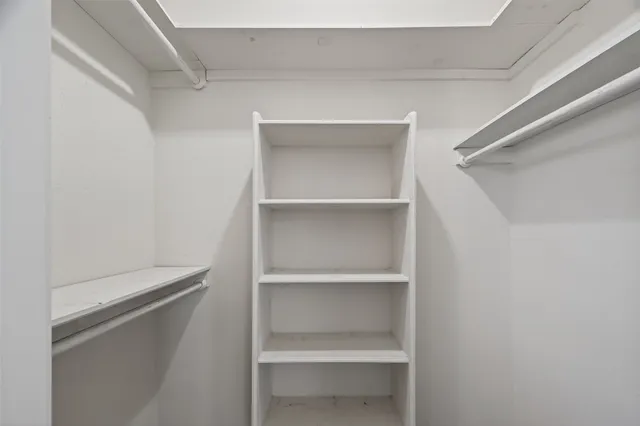 a bathroom with a granite countertop bathtub shower and toilet