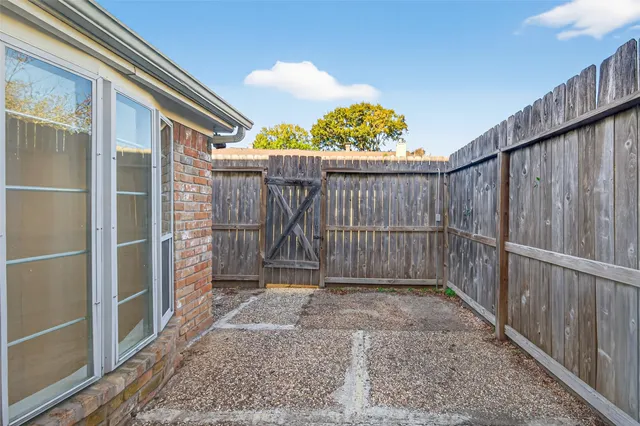 a view of a car parked in front of a house