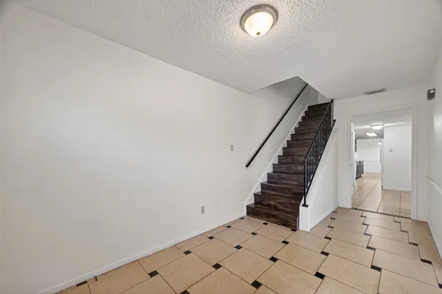 a view of entryway with stairs