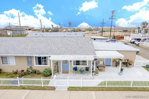a view of a house with a patio yard